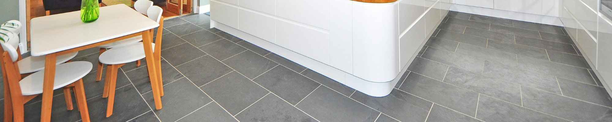 Bright beach-style kitchen with light wood flooring in Bunnell, FL